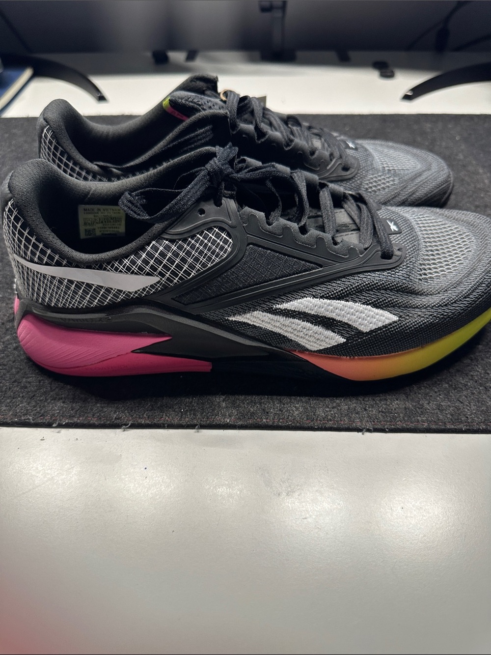 Reebok Men’s Black Training Shoes with Pink & Yellow Gradient Accents